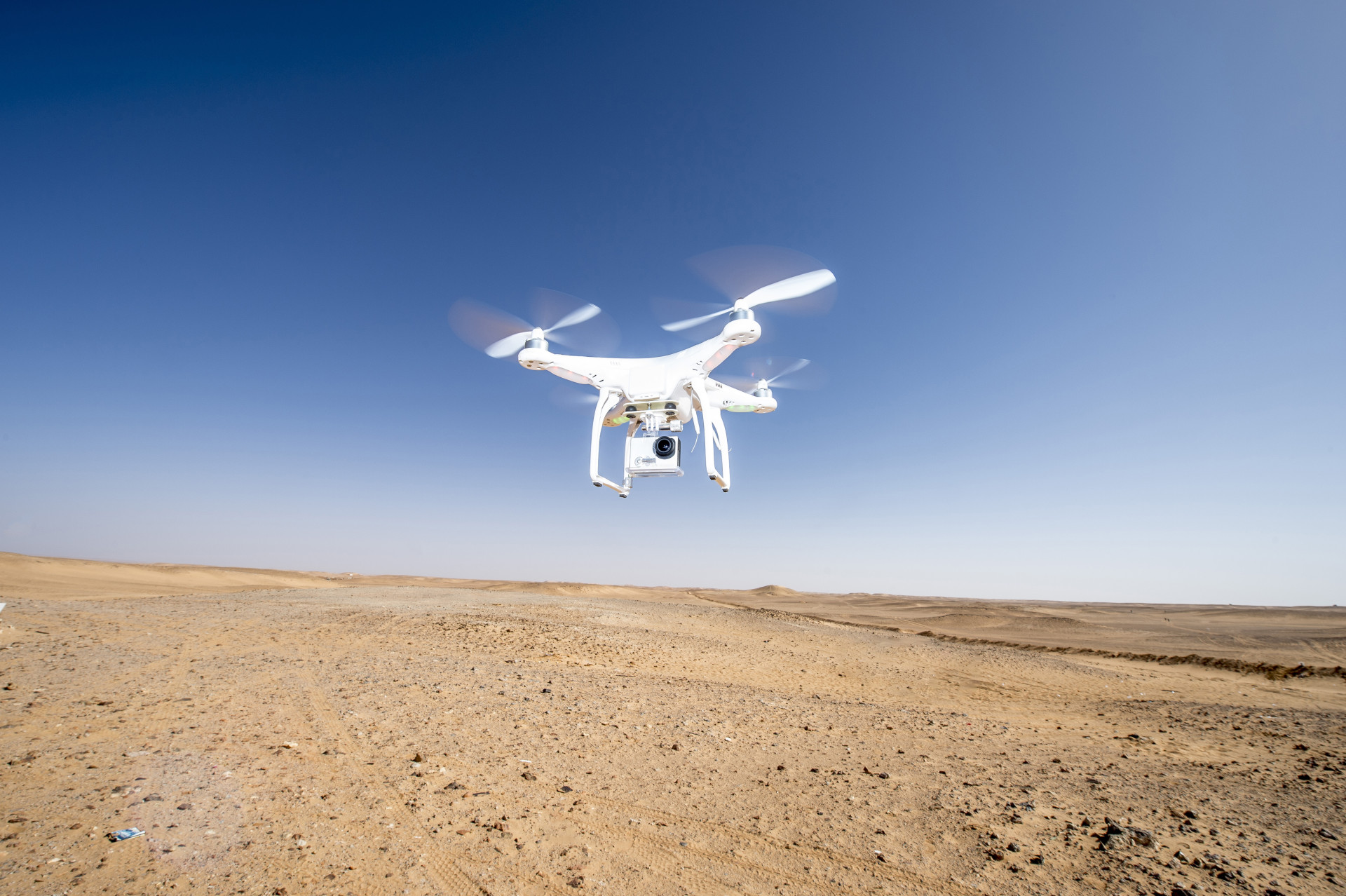 Drone flying over a parched desert area